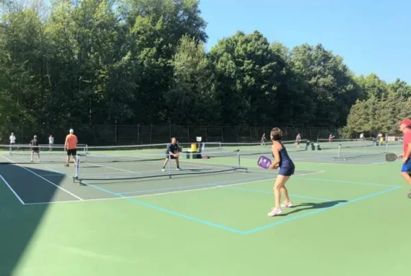Pickleball lessons Chagrin Falls players practicing together on an indoor court