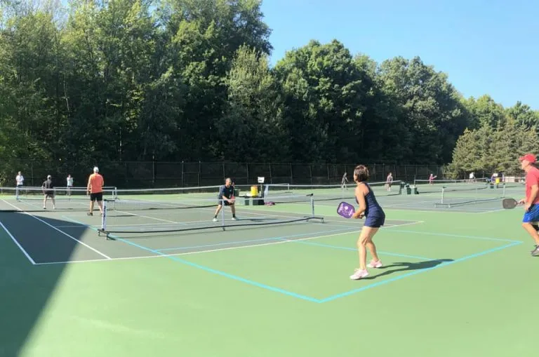 Pickleball lessons Chagrin Falls players practicing together on an indoor court