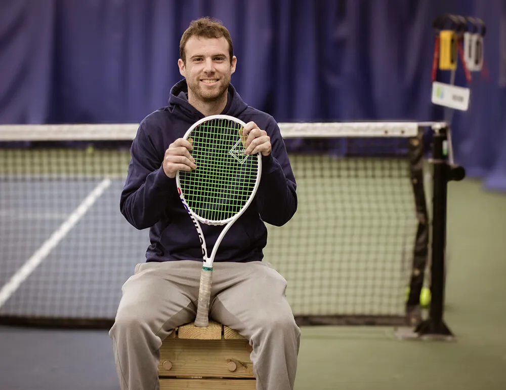 Adult tennis player on an indoor court at The Wembley Club in Chagrin Falls