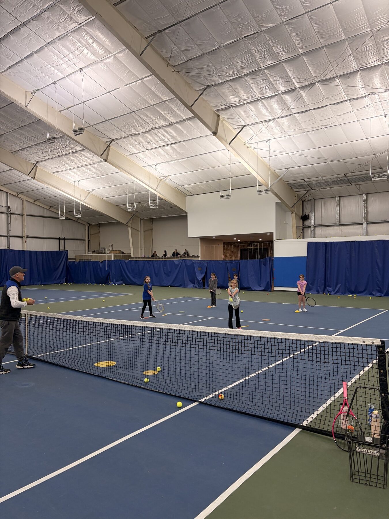 Indoor platform tennis lesson at The Wembley Club