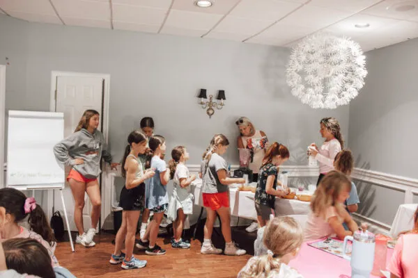 Children and staff gather for a club activity at The Wembley Club