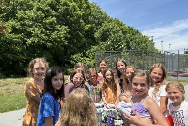 Children gathered beside The Wembley Club courts in Chagrin Falls, Ohio