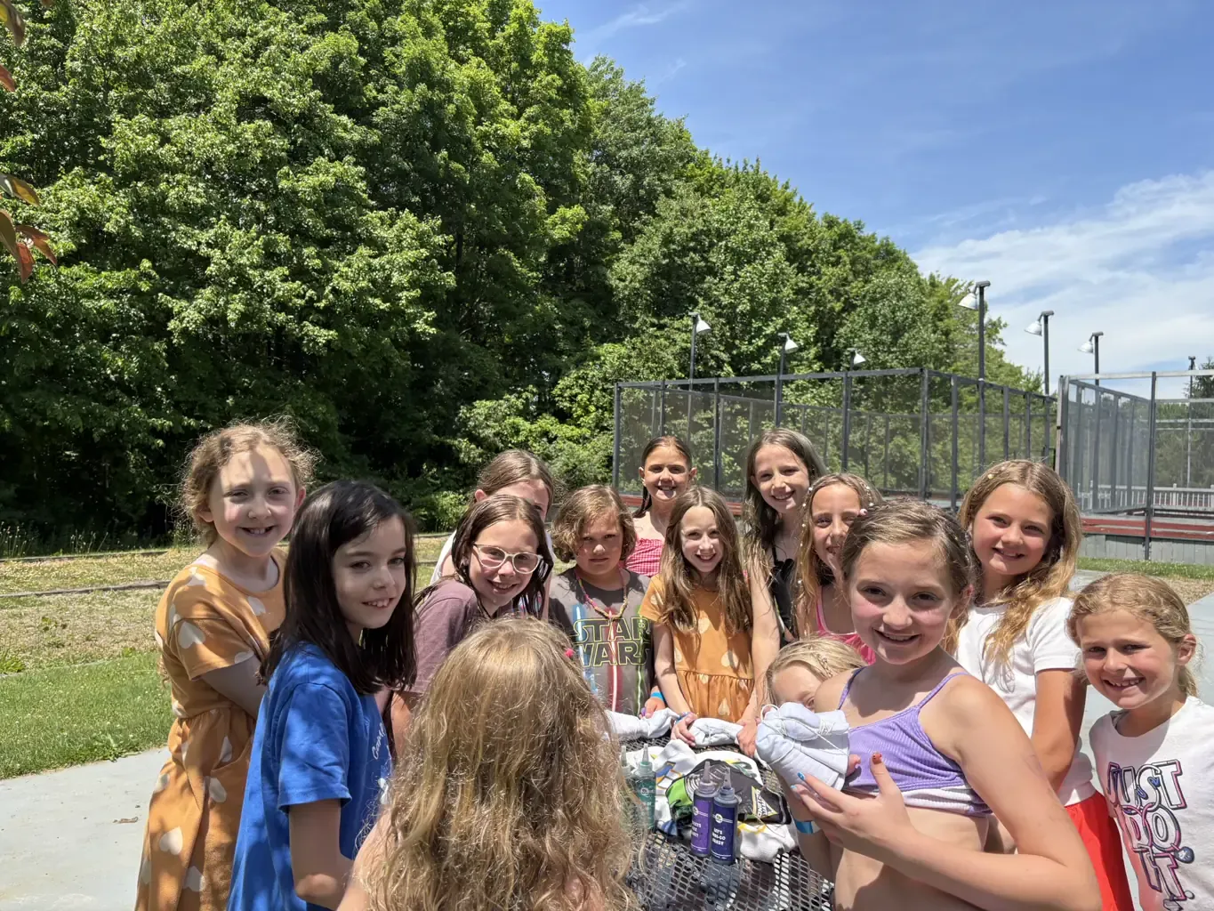 Children gathered beside The Wembley Club courts in Chagrin Falls, Ohio